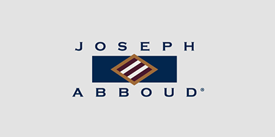 The image displays a logo with text that reads 'JOSEPH ABBOUD' against a background featuring a flag design and a nameplate with the word 'ALEXANDER.